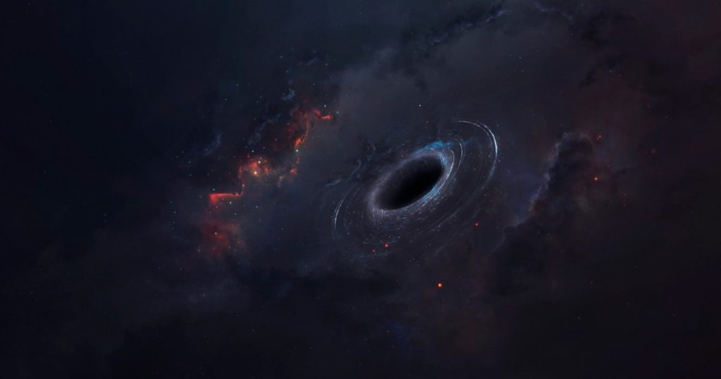 An enigmatic supermassive black hole shrouded in cosmic dust discovered by Israeli astronomers