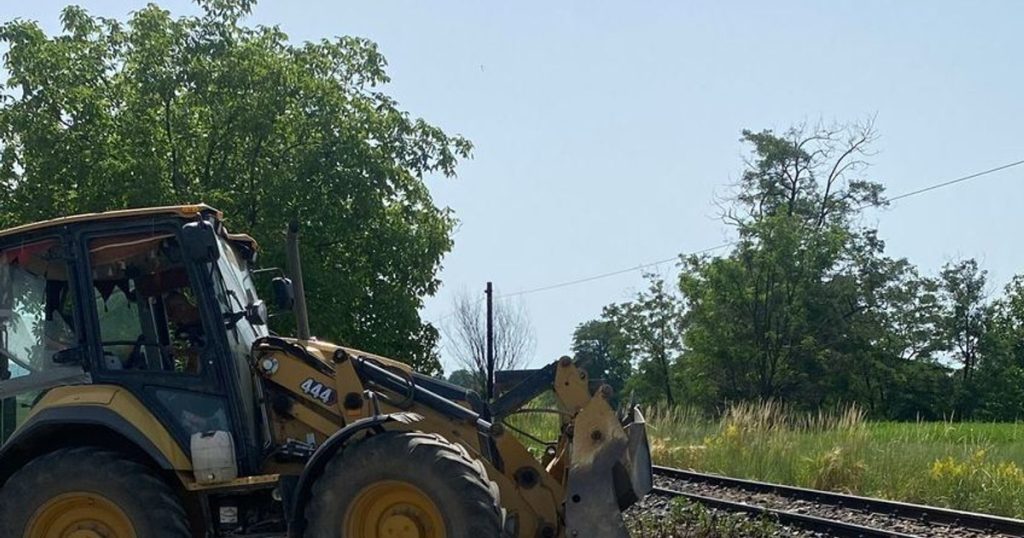 A passenger train hit a machine working near the railway.  Major delay for travelers