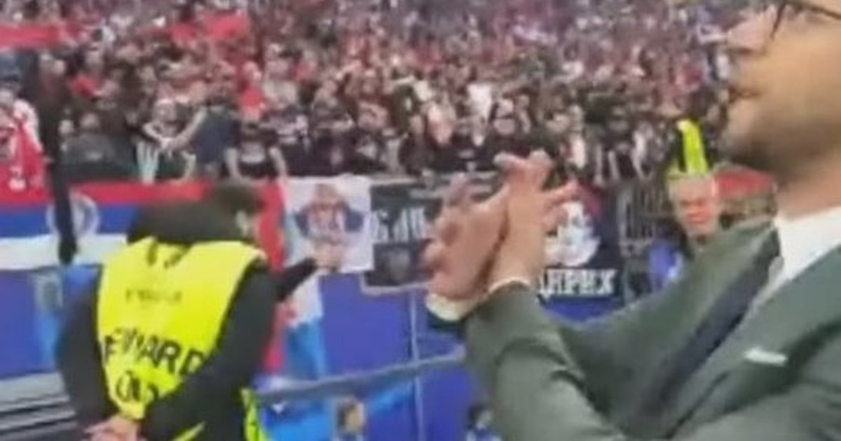 An Albanian journalist lost his accreditation after provoking Serbian fans.  What gesture attracted the attention of UEFA VIDEO