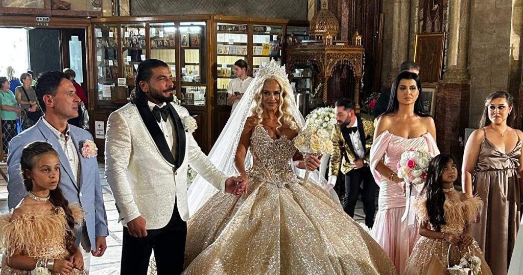 Images of bride Anda Adam in a princess style dress.  "He won't sing at the wedding, because it brings bad luck" PHOTO