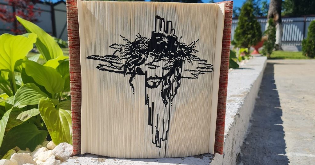 Carving in book pages, the unique hobby of a Romanian woman.  Save destroyed and discarded cards by transforming them into incredible