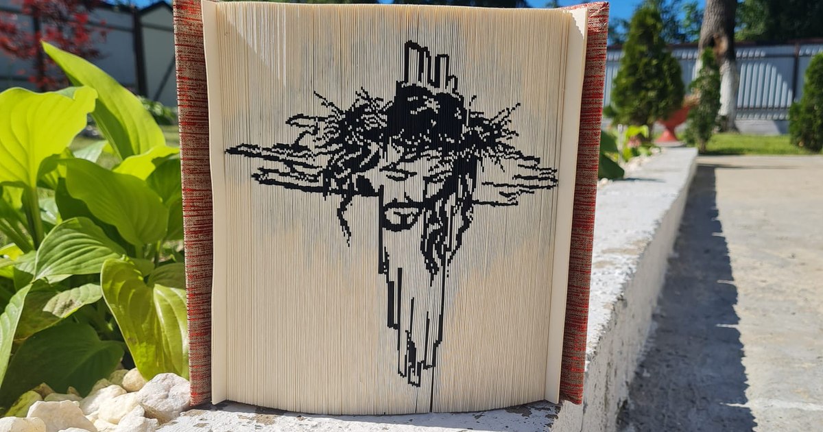 Carving in book pages, the unique hobby of a Romanian woman.  Save destroyed and discarded cards by transforming them into incredible