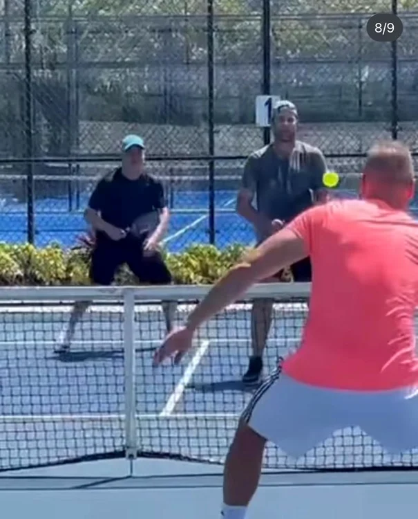 Andre Agassi and Andy Roddick, with Eden Lica on the opposite side of the net