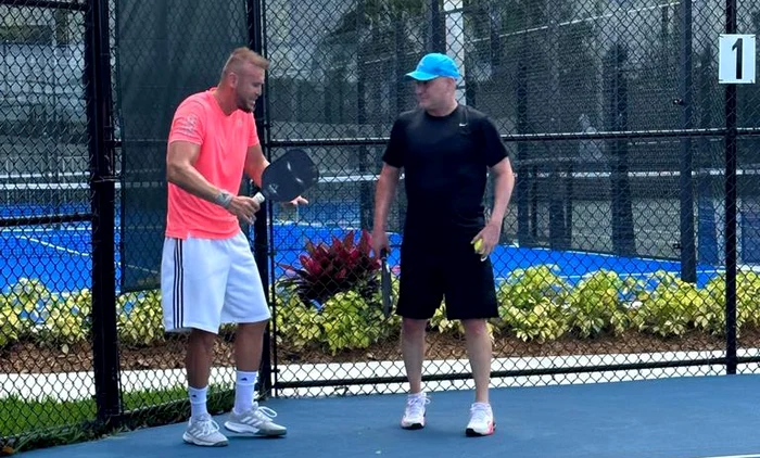 Andre Agassi listens carefully to Eden