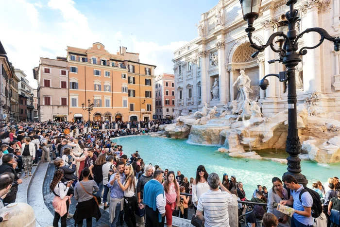 The multitude of tourists from Fontana Di Trevi from Rome Photo Shutterstock