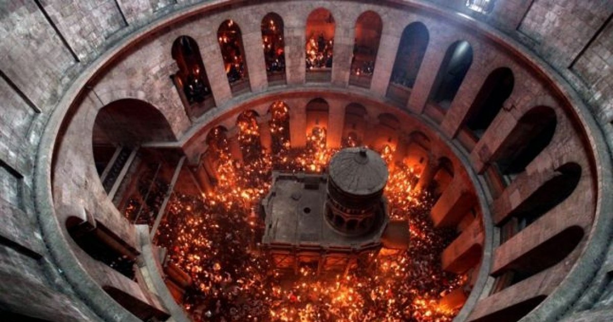 What does the British Encyclopa write about the holy fire in Jerusalem. "Claims of miraculous origin"