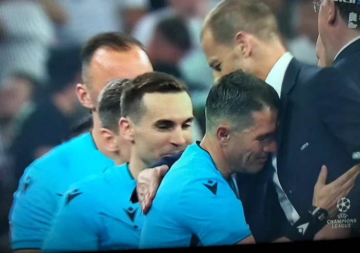 Istvan Kovacs, embraced by Cefer at the end of the match. TV capture