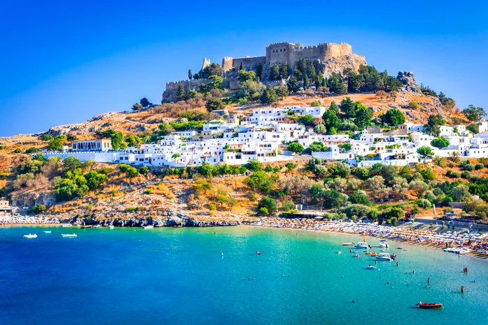 Image with the emblematic fortress of Rhodos surprised from the sea photo shutterstock
