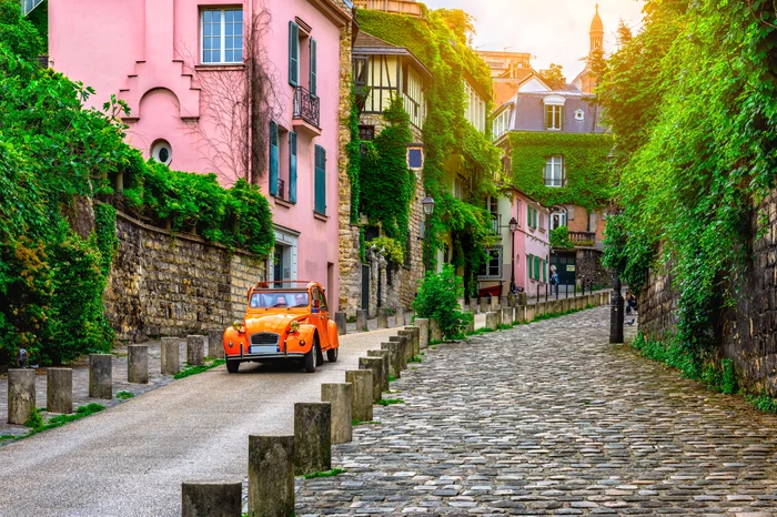 Picturesque street in the Montmartre neighborhood of Paris France Photo Shutterstock