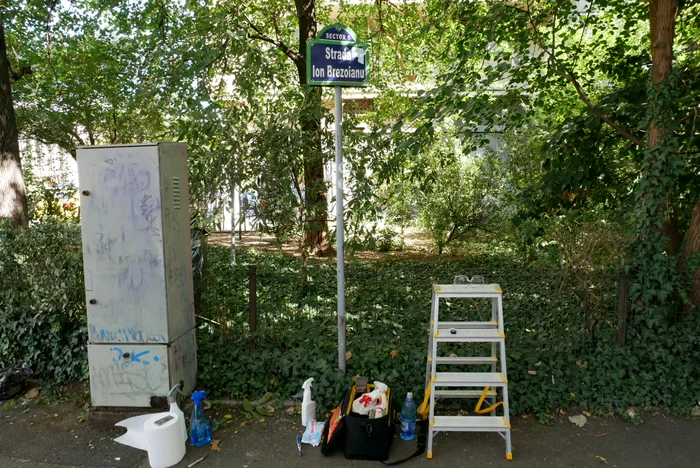 Iulian's cleaning kit includes solutions, a staircase and protective equipment.