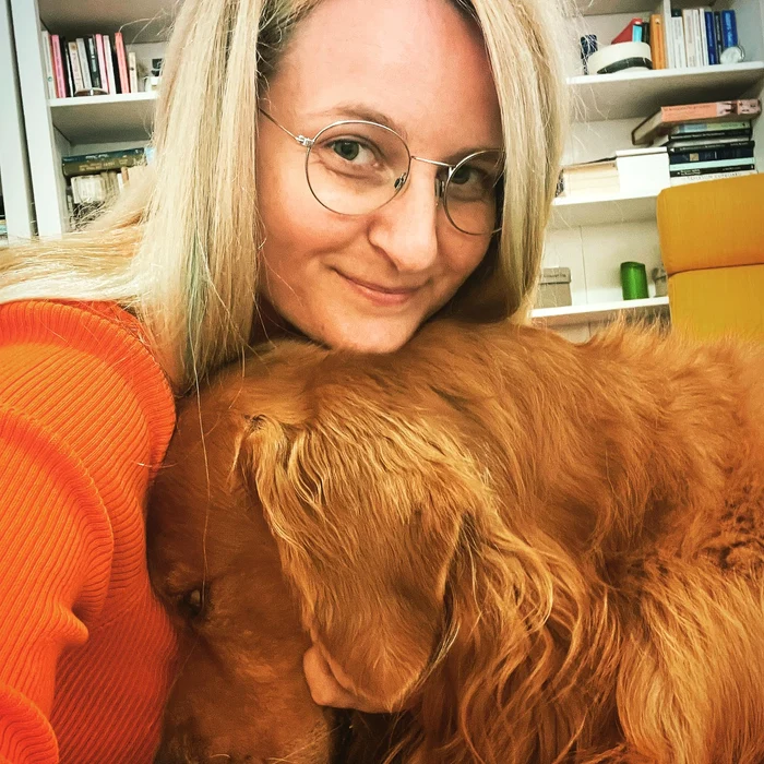 Psychologist Sabina Isdrailă and her dog, Jung