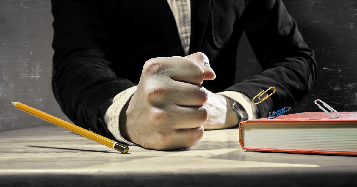 A former school principal will appear before judges after smashing a pupil's head