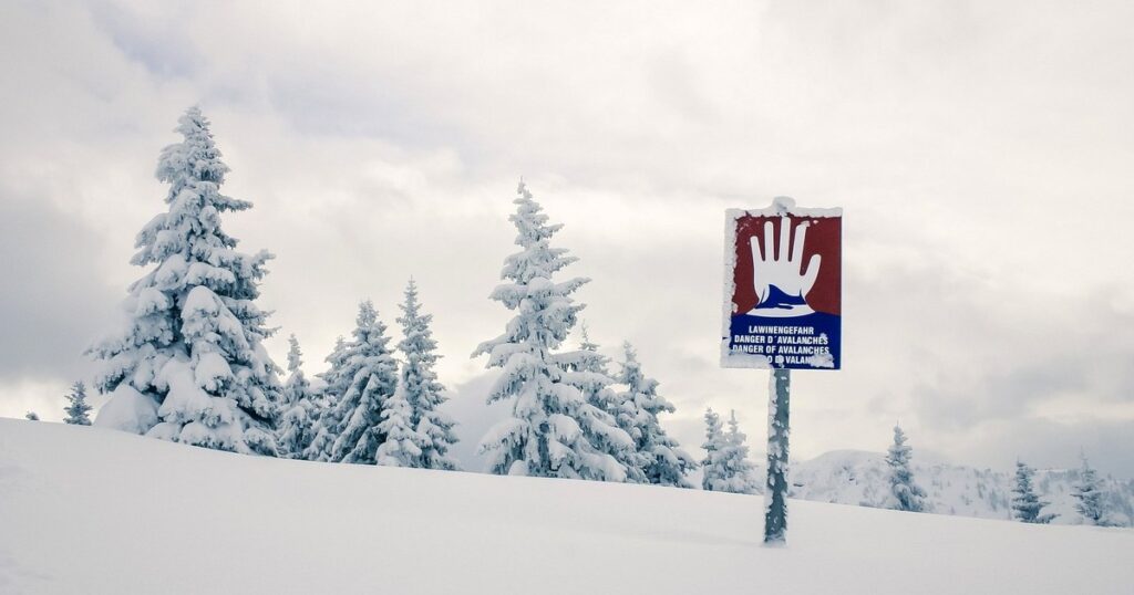 Signs indicating the risk of avalanches in the mountains. What tourists walking on snow should be aware of