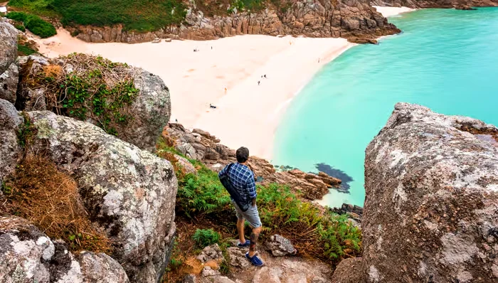 Dramatic cliffs and fine white sand define this Cornish getaway. Photo getyourguide.com