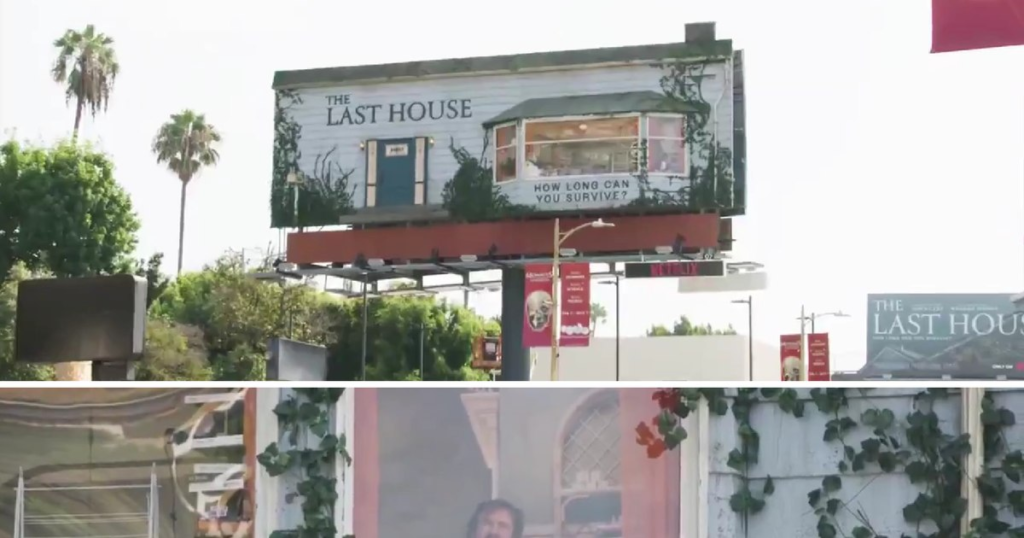 Hired to "live" in a house built in a billboard to promote a movie. "I hope they have air conditioning"